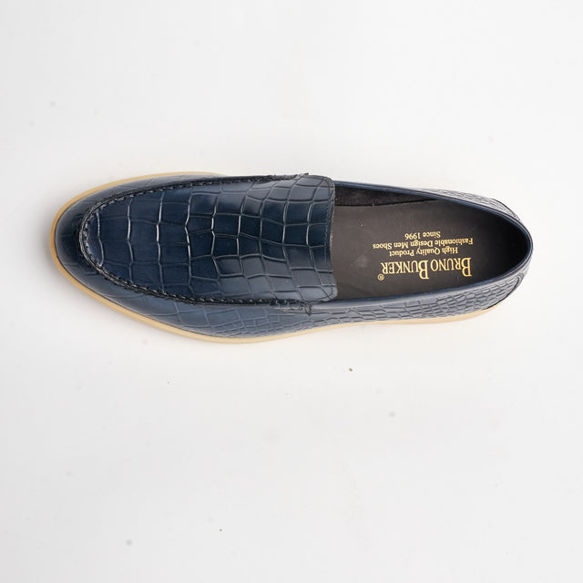 Navy loafer seen from above showing the stitched apron and the branded insole